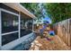 Fenced backyard with a playset and a glimpse of a covered patio, perfect for outdoor fun at 9952 111Th St, Seminole, FL 33772