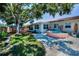 Spacious backyard features a stock tank pool, swing set, and plenty of room for outdoor activities and relaxation at 9952 111Th St, Seminole, FL 33772