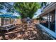 Backyard featuring a swing set, picnic table, and a screened-in porch for outdoor entertainment and relaxation at 9952 111Th St, Seminole, FL 33772