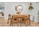 Dining room featuring rustic wooden table with bench seating and decorative elements on the wall at 9952 111Th St, Seminole, FL 33772