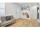 Inviting entryway featuring coat hooks and a comfortable sitting bench with a stylish black and white pillow at 9952 111Th St, Seminole, FL 33772