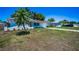 Beautiful single-story home featuring a red tile roof, an attached garage and a well-manicured front yard at 9952 111Th St, Seminole, FL 33772