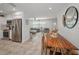 Open kitchen and dining room floorplan with stainless steel appliances and view into the living area at 9952 111Th St, Seminole, FL 33772