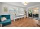 Bright living room featuring modern furniture and large windows offering ample natural light at 9952 111Th St, Seminole, FL 33772