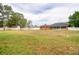 Exterior view of a home with a huge yard, perfect for outdoor activities and gardening at 3234 Morven Dr, Spring Hill, FL 34609