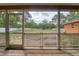 View of a spacious backyard, as seen from the screened-in patio area at 3234 Morven Dr, Spring Hill, FL 34609