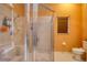This bathroom features an glass enclosed shower stall and tile flooring at 3234 Morven Dr, Spring Hill, FL 34609