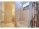This bathroom has tile floors and shower walls, a shower/tub combo and vanity at 3234 Morven Dr, Spring Hill, FL 34609