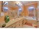 This bathroom offers a tub and glass shower stall at 3234 Morven Dr, Spring Hill, FL 34609