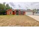Charming single-Gathering home with a well-manicured lawn and inviting front entrance at 3234 Morven Dr, Spring Hill, FL 34609