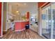 Open-concept kitchen with modern appliances and a view to the living room and screened porch at 3234 Morven Dr, Spring Hill, FL 34609