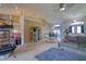 Bright living room featuring neutral carpet, dining area, lots of sunlight and front door access at 3234 Morven Dr, Spring Hill, FL 34609