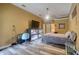 This main bedroom features hard flooring and a combination entertainment center/aquarium at 3234 Morven Dr, Spring Hill, FL 34609