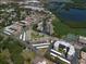 Aerial view of a well-maintained condo community near a pond at 10038 62Nd N Ter # 17, St Petersburg, FL 33708