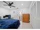 Bedroom showcasing a work desk, closet, and access to an en-suite bathroom at 10038 62Nd N Ter # 17, St Petersburg, FL 33708