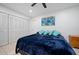 Bright bedroom with a large closet and comfortable blue bedding at 10038 62Nd N Ter # 17, St Petersburg, FL 33708