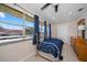 Bedroom featuring a bed with blue covers, large windows for natural light, and a spacious layout at 10038 62Nd N Ter # 17, St Petersburg, FL 33708
