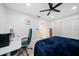 Bedroom featuring a ceiling fan, work desk, and ample closet space at 10038 62Nd N Ter # 17, St Petersburg, FL 33708