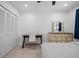 Well-lit bedroom with a closet, desk, dresser, and a comfortable bed for rest and productivity at 10038 62Nd N Ter # 17, St Petersburg, FL 33708
