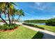 Beautiful community lake view surrounded by palm trees and manicured landscaping at 10038 62Nd N Ter # 17, St Petersburg, FL 33708