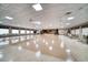 Spacious event space featuring tables, chairs, a stage, and elegant lighting, perfect for gatherings at 10038 62Nd N Ter # 17, St Petersburg, FL 33708