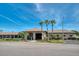 The community's building with a fountain and palms in front at 10038 62Nd N Ter # 17, St Petersburg, FL 33708