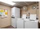 Functional laundry room with multiple washers and dryers, perfect for convenient on-site laundry services at 10038 62Nd N Ter # 17, St Petersburg, FL 33708