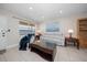 Inviting living room features tile floors, a plush sofa, and a comfortable massage chair at 10038 62Nd N Ter # 17, St Petersburg, FL 33708