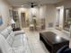Spacious living room area with tile floors, and view to the dining table and access to the kitchen at 10038 62Nd N Ter # 17, St Petersburg, FL 33708