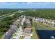 Aerial view showcases waterfront homes near a canal and lush green landscape at 10205 Charleston Corner Rd, Tampa, FL 33635