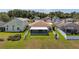 Aerial view of backyard with lanai, and perimeter fence, nestled in residential neighborhood at 10205 Charleston Corner Rd, Tampa, FL 33635