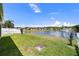 A beautiful backyard view with lush grass that overlooks a pond at 10205 Charleston Corner Rd, Tampa, FL 33635