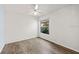 White walls, hardwood floor and ceiling fan are featured in this bedroom at 10205 Charleston Corner Rd, Tampa, FL 33635