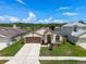 Charming single-story home with landscaped front yard and attached two-car garage at 10205 Charleston Corner Rd, Tampa, FL 33635