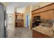 Open kitchen with granite countertops, stainless steel appliances, and adjoining dining area at 10205 Charleston Corner Rd, Tampa, FL 33635