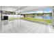 Enjoy the peaceful lake view from this bright enclosed lanai with tile flooring at 10205 Charleston Corner Rd, Tampa, FL 33635