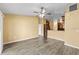 Bright living room with laminate flooring, neutral walls, and a lake view at 10205 Charleston Corner Rd, Tampa, FL 33635