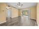 Spacious living room features updated flooring and sliding glass doors to the lanai with a view of the pond at 10205 Charleston Corner Rd, Tampa, FL 33635