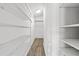 Walk-in closet with custom shelving at 10205 Charleston Corner Rd, Tampa, FL 33635