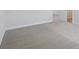 Bedroom boasts soft carpeting and a neutral color scheme at 10320 Longmeadow Ave, Parrish, FL 34219