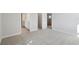 Bedroom features neutral walls and soft carpeting, as well as an entrance to a walk-in closet at 10320 Longmeadow Ave, Parrish, FL 34219