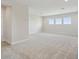 Spacious bonus room with plush carpeting, three large windows, and plenty of natural light at 10320 Longmeadow Ave, Parrish, FL 34219