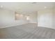 Spacious bonus room featuring neutral walls, soft carpeting, and recessed lighting at 10320 Longmeadow Ave, Parrish, FL 34219