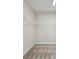 Walk in closet featuring wire shelving, neutral walls and carpeted floor at 10320 Longmeadow Ave, Parrish, FL 34219