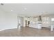 Expansive living space with open concept and a gourmet kitchen featuring state-of-the-art stainless steel appliances at 10320 Longmeadow Ave, Parrish, FL 34219