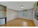 Spacious bedroom with light wood flooring and a built in shelving unit at 104 E Saint Johns Way, Apollo Beach, FL 33572