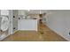 Open-concept living area with wood-look flooring seamlessly connects to the adjacent kitchen at 104 E Saint Johns Way, Apollo Beach, FL 33572