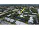 Community aerial view highlighting proximity to pond, pool, and mature trees at 11201 122Nd Ave # 167, Largo, FL 33778