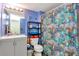 Bright bathroom featuring a vanity and a shower with colorful fish-themed curtain at 11201 122Nd Ave # 167, Largo, FL 33778