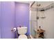 Small bathroom with a shower and toilet in a confined space, utilizing vertical space at 11201 122Nd Ave # 167, Largo, FL 33778
